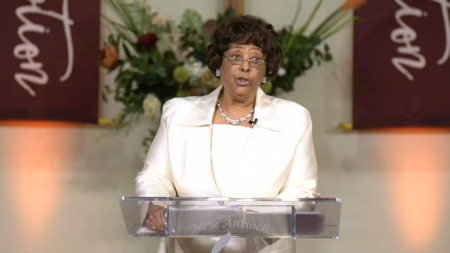 Barbara McCoo Lewis, General Supervisor of the International Women’ Department, preaching the closing message of "COGIC Family Thanksgiving." The appearance is unusual because the predominantly African American denomination does not ordain women or allow them to be pastors.