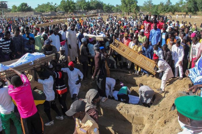 Mourners attend the funeral of 43 farm workers in Zabarmari, about 20km from Maiduguri, Nigeria, on November 29, 2020 after they were killed by Boko Haram fighters in rice fields near the village of Koshobe on November 28, 2020. 