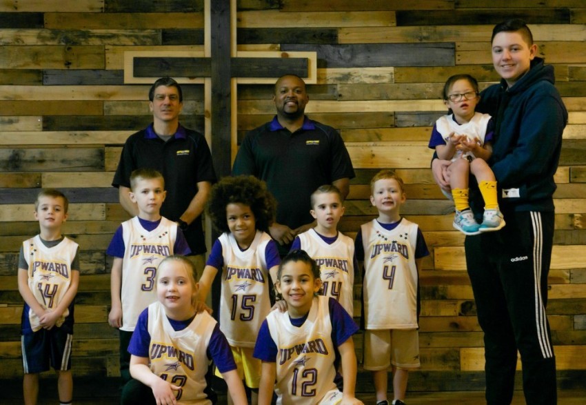 Alli Nguyen, far right being held, and her Upward Sports league in Erie County in western New York.