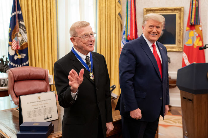President Donald J. Trump presents the Medal of Freedom to Lou Holtz Thursday, Dec. 3, 2020, in the Oval Office of the White House. 