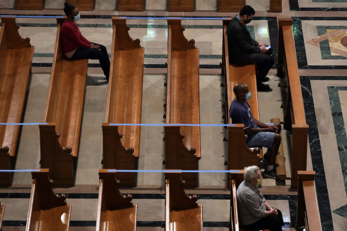 Members of the congregation participate in a mass at the Basilica of the National Shrine of the Immaculate Conception June 22, 2020, in Washington, D.C.