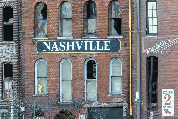 Police close off an area damaged by an explosion on Christmas morning on December 25, 2020, in Nashville, Tennessee. A Hazardous Devices Unit was en route to check on a recreational vehicle which then exploded, extensively damaging some nearby buildings. According to reports, the police believe the explosion to be intentional, with at least three injured and human remains found in the vicinity of the explosion. 
