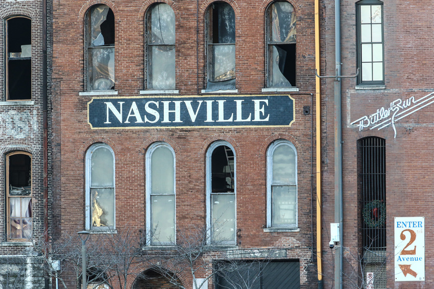 Police close off an area damaged by an explosion on Christmas morning on December 25, 2020, in Nashville, Tennessee. A Hazardous Devices Unit was en route to check on a recreational vehicle which then exploded, extensively damaging some nearby buildings. According to reports, the police believe the explosion to be intentional, with at least three injured and human remains found in the vicinity of the explosion.