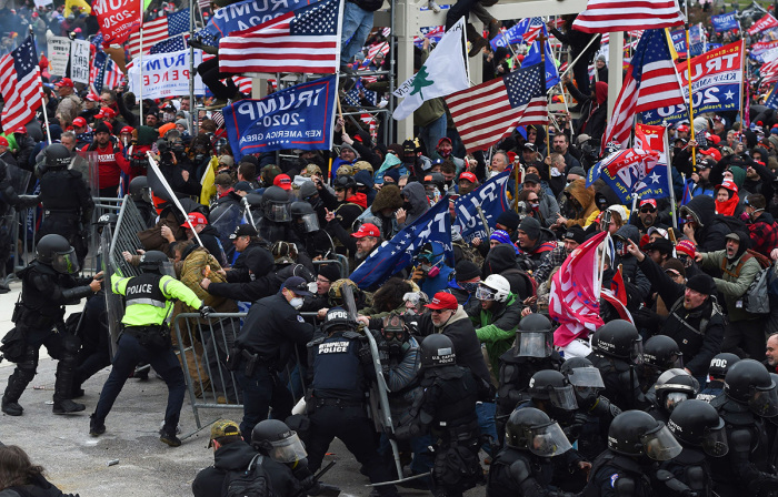 President Trump supporters clash with police and security forces as they push barricades to storm the U.S. Capitol in Washington, D.C., on January 6, 2021. Demonstrators breached security and entered the Capitol as Congress debated the 2020 presidential election Electoral Vote Certification. 