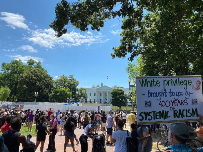 People gather near the White House during a peaceful protest against police brutality and racism, on June 13, 2020, in Washington, DC. 