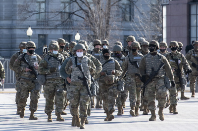 Members of the National Guard arrive as the U.S. Capitol goes into lockdown due to a threat during the dress rehearsal for the inauguration of President-elect Joe Biden on January 18, 2021, in Washington, D.C. The inauguration will take place on January 20. 