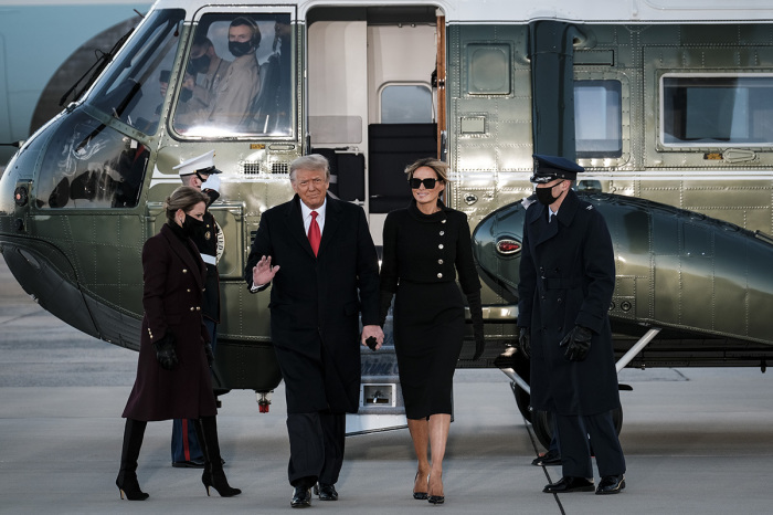 President Donald Trump and first lady Melania Trump arrive to speak to supporters prior to boarding Air Force One to head to Florida on January 20, 2021, in Joint Base Andrews, Maryland. Trump, the first president in more than 150 years to refuse to attend his successor's inauguration, is expected to spend the final minutes of his presidency at his Mar-a-Lago estate in Florida. 