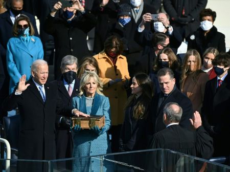 Joe Biden is sworn in as the 46th president of the United States by Chief Justice John Roberts as Jill Biden holds the Bible during the 59th Presidential Inauguration at the U.S. Capitol on January 20, 2021 in Washington, D.C..