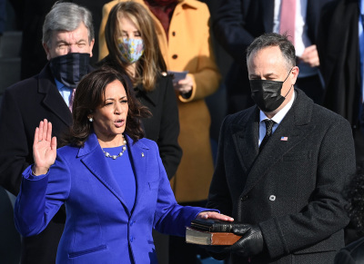 Kamala Harris, flanked by her husband Doug Emhoff, is sworn in as the 49th U.S. Vice President by Supreme Court Justice Sonia Sotomayor on January 20, 2021, at the U.S. Capitol in Washington, D.C.