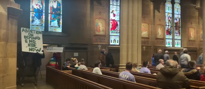 Pro-abortion protesters disrupt a pro-life mass at St. Joseph Cathedral in Columbus, Ohio Friday as Catholics gathered on the 48th anniversary of the Roe v. Wade Supreme Court decision that legalized abortion nationwide. 