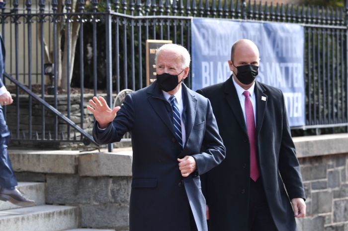 US President Joe Biden(C) leaves Holy Trinity Catholic Church in the Georgetown neighborhood of Washington,DC on January 24, 2021. 