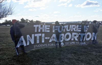 Pro-life protesters gather at Gravelly Point in Arlington, Virginia, to form a Life Chain in lieu of the March for Life, on Jan. 29, 2021.