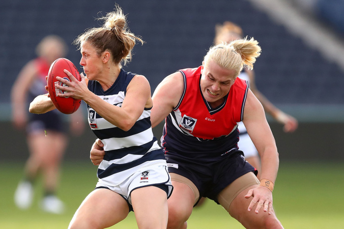 Anna Teague of the Cats is tackled by trans-identified athlete Hannah Mouncey of the Falcons during the round six VFLW match between Geelong and Darebin at GMHBA Stadium on June 16, 2018, in Geelong, Australia. 