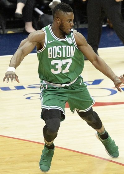 Semi Ojeleye of the Boston Celtics defends a Washington Wizards player during a 2018 game.