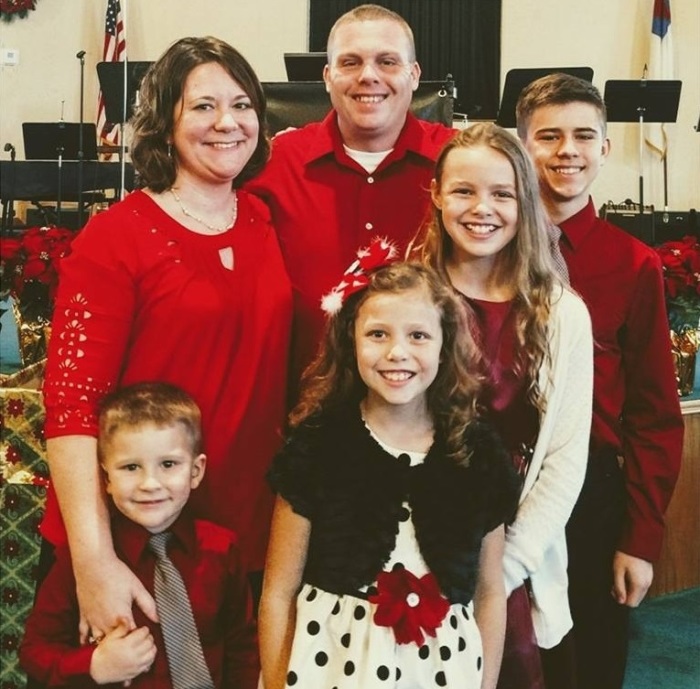 Pastor Jacob White, his wife Amanda and their four children.