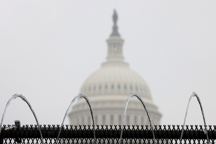 Razor wire is shown atop a fence outside the U.S. Capitol on Feb. 13, 2021, in Washington, D.C. 