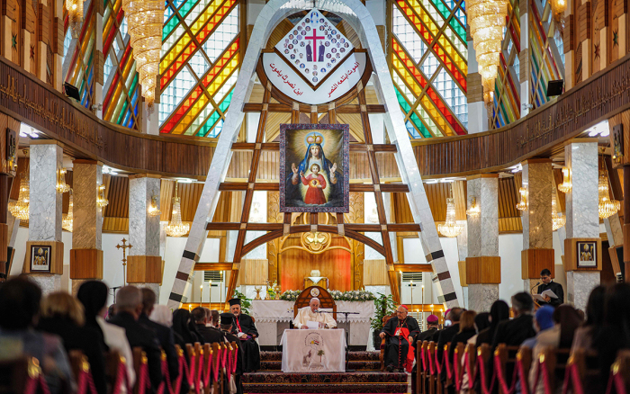 Pope Francis (C) delivers a sermon at the Syriac Catholic Cathedral of Our Lady of Salvation (Sayidat al-Najat) in Baghdad at the start of the first ever papal visit to Iraq on March 5, 2021, accompanied by Cardinal Louis Raphael I Sako (C-R), Patriarch of Babylon of the Chaldeans and head of the Chaldean Catholic Church, and Ignatius Joseph III Yunan (C-L), Syriac Catholic Patriarch of Antioch and all the East of the Syriacs. - In an address to the faithful in Baghdad, Pope Francis expressed his gratitude to his fellow clergy for supporting Iraq's Christians, whose population has dwindled due to conflict. 