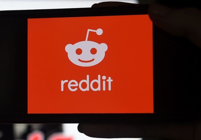This photo illustration shows the logo of Reddit on a mobile phone in Arlington, Virginia on January 29, 2021. (