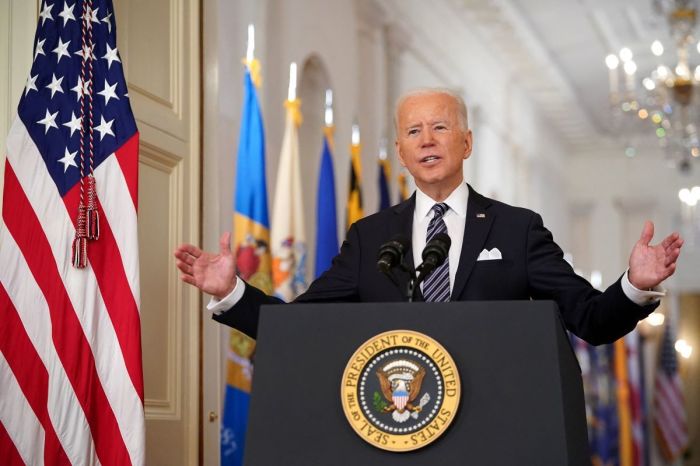 U.S. President Joe Biden gestures as he speaks on the anniversary of the start of the COVID-19 pandemic in the East Room of the White House in Washington, D.C., on March 11, 2021. 
