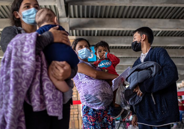 Central American asylum seekers arrive to a bus station after being released by U.S. Border Patrol agents on February 26, 2021, in Brownsville, Texas. U.S. immigration authorities are now releasing many asylum seekers after they cross the U.S.-Mexico border and are taken into custody. The immigrants are then free to travel to destinations throughout the U.S. while awaiting asylum hearings. 