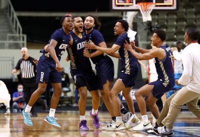 The Oral Roberts Golden Eagles celebrate after defeating the Florida Gators in the second round game of the 2021 NCAA Men's Basketball Tournament at Indiana Farmers Coliseum on March 21, 2021 in Indianapolis, Indiana.