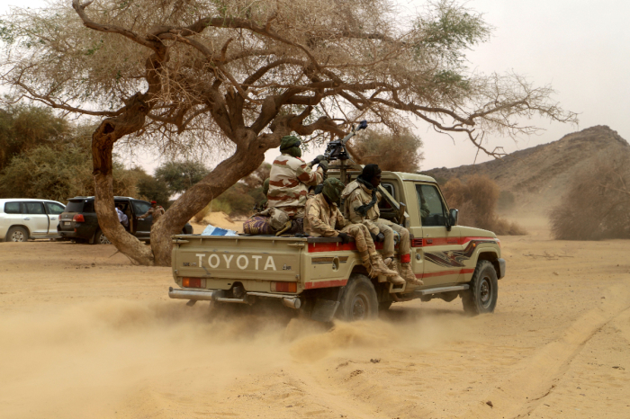Niger soldiers patrol in the desert of Iferouane on February 12, 2020 to protect tourists and dignitaries during the Air Festival. 