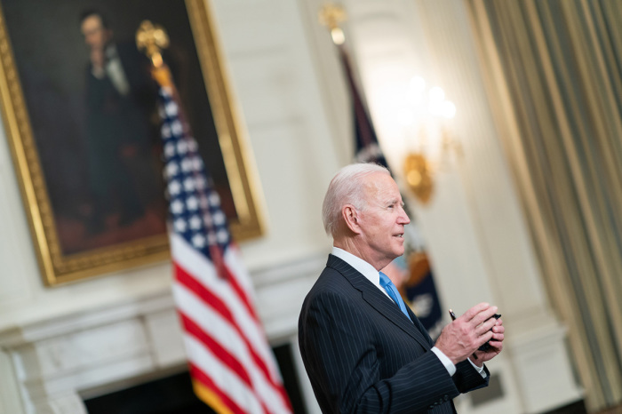 President Joe Biden talks to members of the press in the State Dining Room of the White House on March 2, 2021, after delivering remarks during a COVID-19 announcement.
