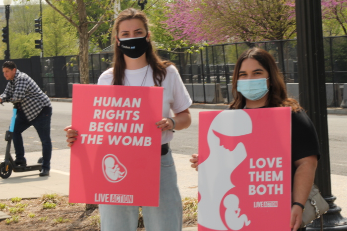 Julia and Maria, two American University students, hold pro-life signs at the Democrats for Life of America's Save Hyde National Day of Action in Washington, D.C. on Apr. 10, 2021.