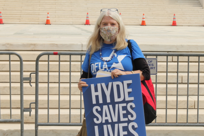 Kathy Kelly, director of the Maryland chapter of the Democrats for Life of America, poses with her pro-life sign at the Save Hyde National Day of Action in Washington, D.C. on Apr. 10, 2021.