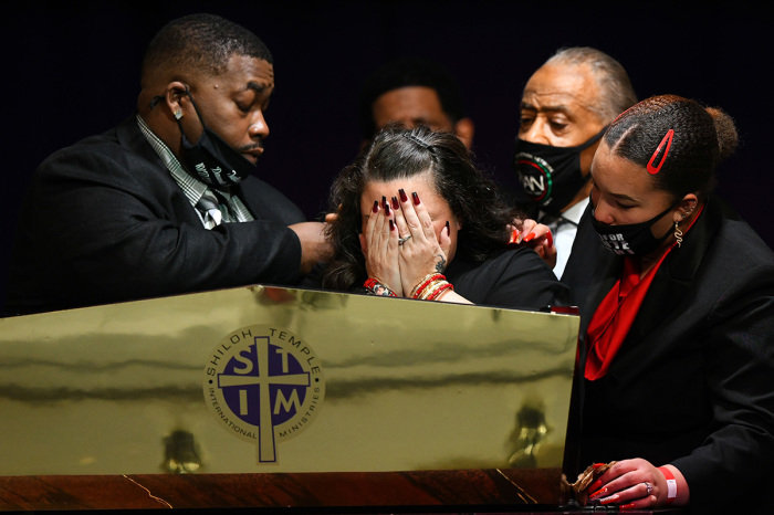 Father Aubrey Wright (L) and mother Katie Wright (2L) give remarks alongside sister Diamond Wright (R) and the Rev. Al Sharpton during a funeral held for Daunte Wright at Shiloh Temple International Ministries on April 22, 2021, in Minneapolis, Minnesota. Daunte Wright was shot and killed by police during a traffic stop for an active warrant in Brooklyn Center, Minnesota, on April 11 which sparked days of protests.