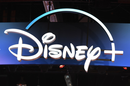 A Disney+ streaming service sign is pictured at the D23 Expo, billed as the 'largest Disney fan event in the world,' on August 23, 2019, at the Anaheim Convention Center in Anaheim, California.