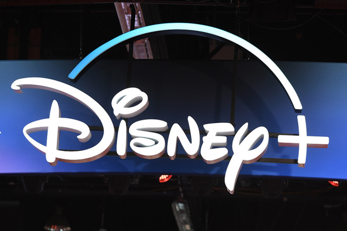 A Disney+ streaming service sign is pictured at the D23 Expo, billed as the 'largest Disney fan event in the world,' on August 23, 2019, at the Anaheim Convention Center in Anaheim, California. 
