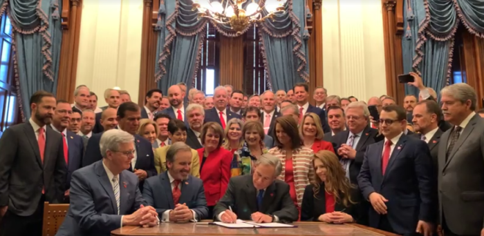 Gov. Greg Abbott, R-Texas, signs Senate Bill 8 into law, which bans abortions after a fetal heartbeat can be detected, usually around six weeks gestation.