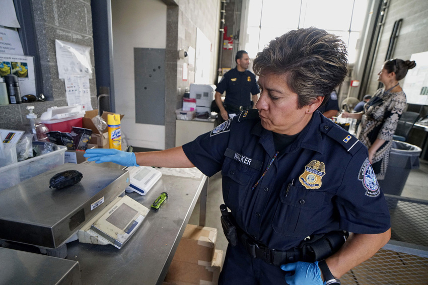 An Immigration and Customs Enforcement (ICE) agent weighs a package of Fentanyl at the San Ysidro Port of Entry on October 2, 2019, in San Ysidro, California. - Fentanyl, a powerful painkiller approved by the U.S. Food and Drug Administration for a range of conditions, has been central to the American opioid crisis which began in the late 1990s. China was the first country to manufacture deadly illegal fentanyl for the U.S. market, but the problem surged when trafficking through Mexico began around 2005.