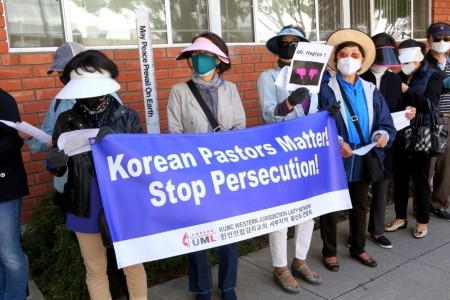 Protestors rally against the reassignment of three Korean pastors in the California-Pacific Conference of the United Methodist Church on May 21, 2021.