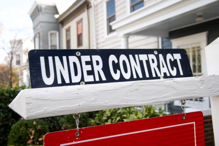 A real estate sign shows a home as being 'under contract' in Washington, D.C., on Nov. 19, 2020. 