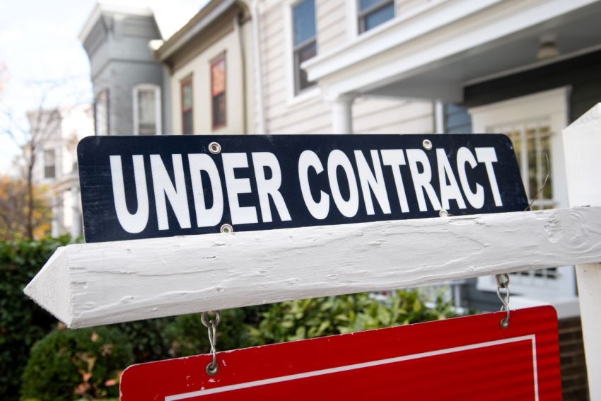 A real estate sign shows a home as being "under contract" in Washington, D.C., on Nov. 19, 2020.