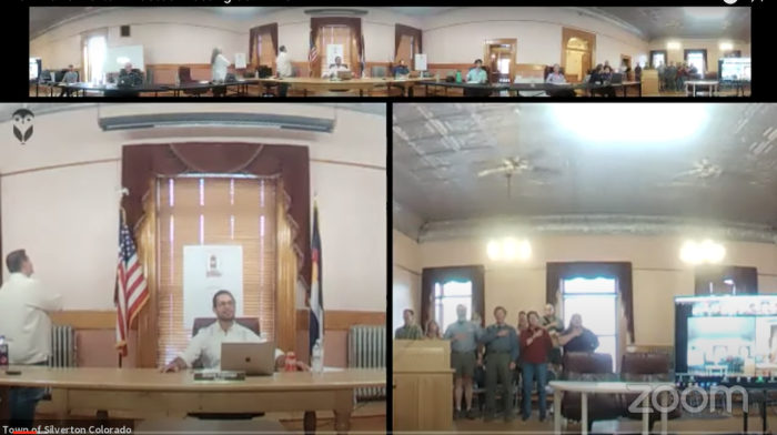 Members of the board of trustees in Silverton, Colorado, recite the Pledge of Allegiance at a board meeting despite a ban on the pledge imposed by Mayor Shane Fuhrman on June 14, 2021.