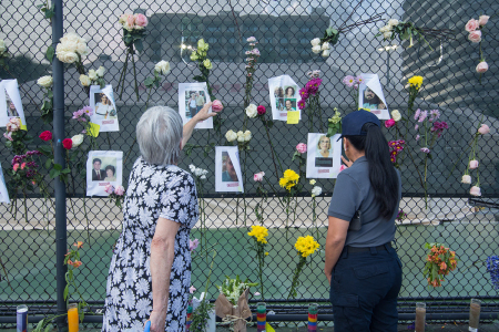 People view a makeshift memorial near the site of the residential building collapse in Miami-Dade County, Florida, the United States, on June 26, 2021. The death toll from the partial collapse of a 12-story residential building has risen to five while the number of missing people rose to at least 159, local media reported on Saturday.