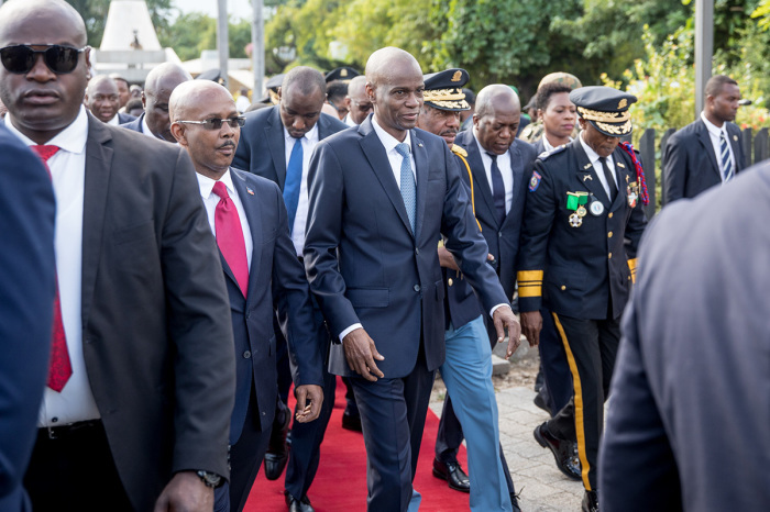 Hatian President Jovenel Moise (C) leaves the MUPANAH (Haitian National Pantheon Museum) to go to a military parade to commemorate Battle of Vertieres Day, the last major battle of the Second War of Haitian Independence, at the Presidential Palace in Port-au-Princeon November 18, 2019. 