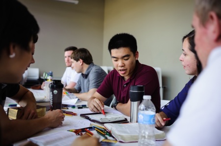 Students belonging to InterVarsity Christian Fellowship engaging in a Bible study.