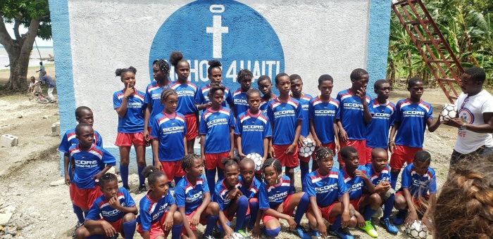 Haitian children in soccer jerseys at Anchor4Haiti.