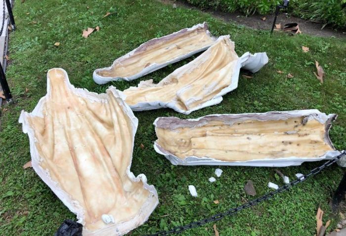 Shattered pieces of a statue lay on the ground outside Our Lady of Mercy Church in New York City after being vandalized in July 2021. 