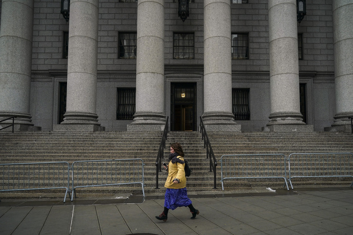 A woman walks past the Thurgood Marshall United States Courthouse, which hears cases from the United States District Court for the Southern District of New York and United States Court of Appeals for the Second Circuit, stands in Lower Manhattan, January 18, 2019 in New York City. The Administrative Office of the U.S. Courts, which supports the federal court system, is set to run out of funds on January 25, due to the partial government shutdown. Without this funding, federal courts will continue functioning, but with smaller staffs and only mission-critical operations. 