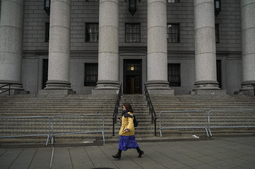 A woman walks past the Thurgood Marshall United States Courthouse, which hears cases from the United States District Court for the Southern District of New York and United States Court of Appeals for the Second Circuit, stands in Lower Manhattan, January 18, 2019 in New York City. The Administrative Office of the U.S. Courts, which supports the federal court system, is set to run out of funds on January 25, due to the partial government shutdown. Without this funding, federal courts will continue functioning, but with smaller staffs and only mission-critical operations.