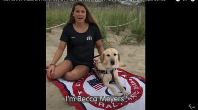 Blind-deaf Paralympic swimmer Becca Meyers speaks in a video with her guide dog, Birdie. She withdrew from the Tokyo games on July 18, 2021, after being denied a personal care assistant due to COVID-19 personnel restrictions. 