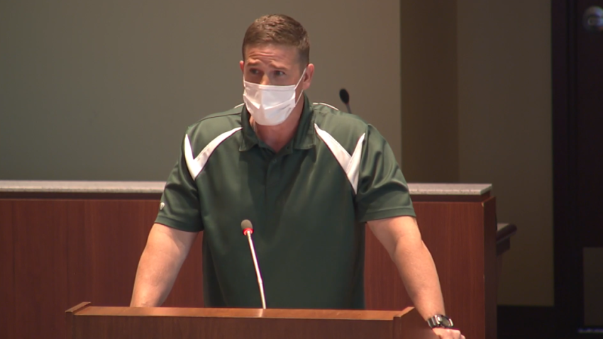 Byron Tanner Cross, a physical education teacher at Leesburg Elementary School, speaks before a meeting of the Loudon County School Board of Loudon, Virginia, on Tuesday, May 25, 2021.
