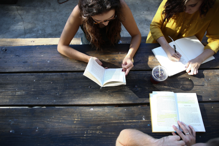 Students read together on campus.