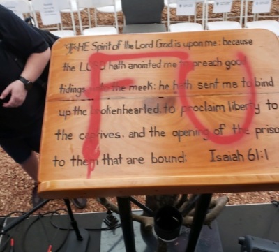 Pastor Greg Locke's podium sits at Global Vision Bible Church in Tennessee after being vandalized by an unknown party around on Sunday, Aug. 15, 2021. 