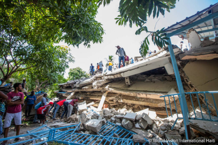 People assess damage after a 7.2 magnitude earthquake struck Haiti on Aug. 14, 2021. 
